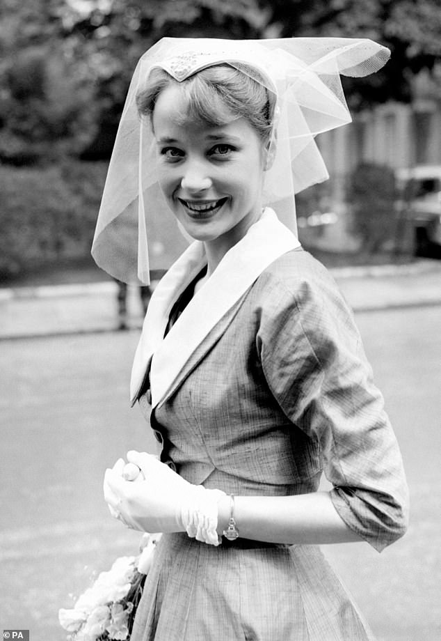 Sylvia, wearing a lace headdress, leaves after her wedding to her childhood sweetheart, Mr Alan Edney, at St Paul's Church, Onslow Square, London, in 1956.