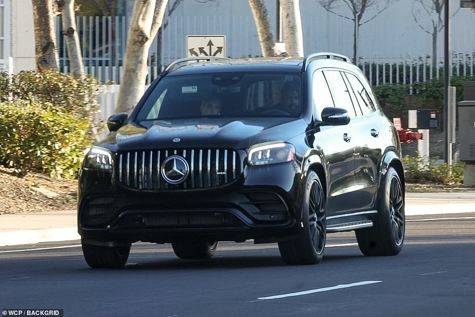 Grand arrival: The rapper and Yeezy architect were spotted arriving at the venue in a black Mercedes, two weeks after holding a private wedding ceremony