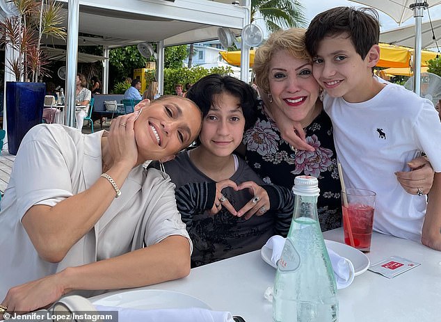 Her children: J-Lo shares her 14-year-old twins with her third husband, ex Marc Anthony, pictured with her mother and children Emme and Max.