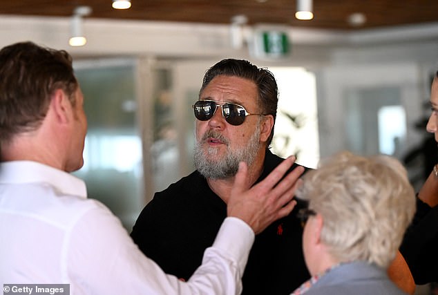 The award-winning New Zealand actor mingled happily with other event attendees, at one point seen stroking his well-groomed beard in thought.