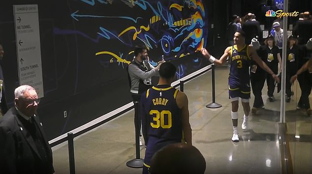 Jordan Poole (right) threw his mouth guard on a funny shot at Curry, who was ejected for it.