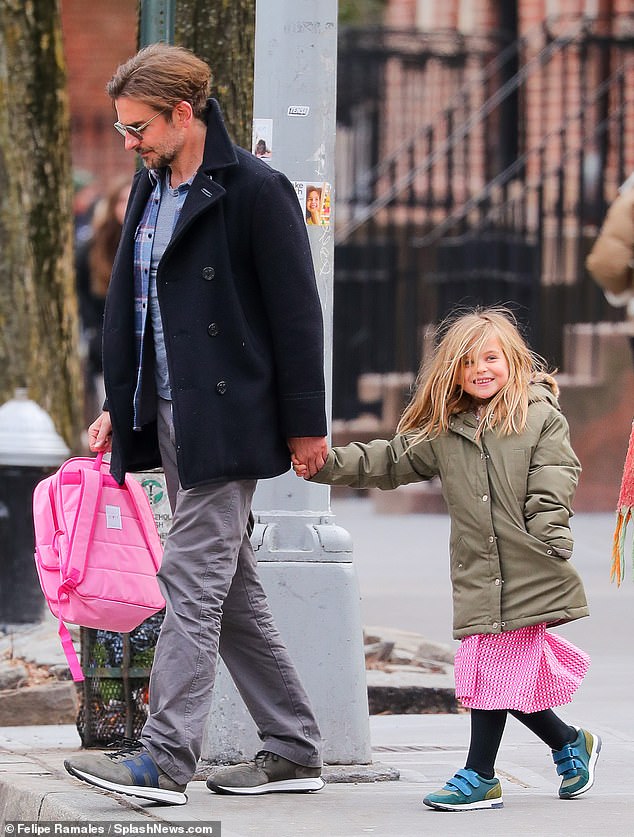 Cute: The 48-year-old actor who shares Lea with Russian model Irina Shayk chatted with his daughter and carried her backpack as they strolled