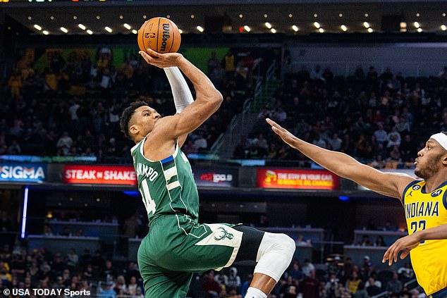 Antetokounmpo (34) shoots the ball as Indiana Pacers center Myles Turner (33) tries to block