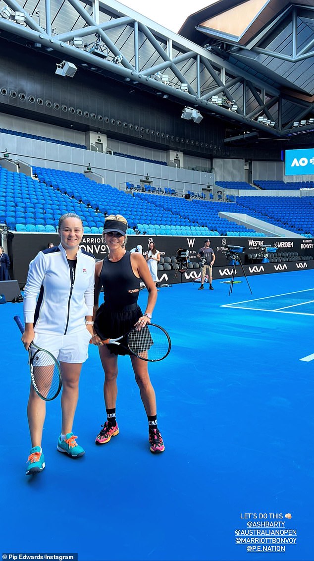 Pip Edwards, 42, (right) walked onto the court with tennis great Ash Barty, 26, (left) on Saturday as they hit some rackets at the Australian Open at Melbourne Park.