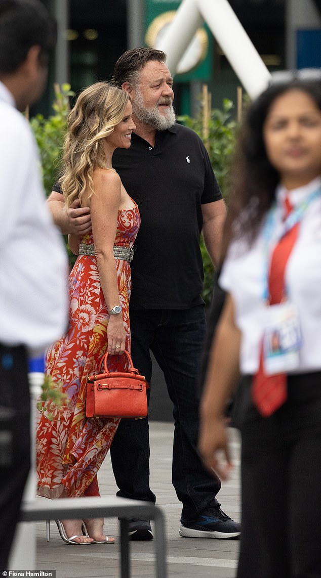 The 58-year-old New Zealand actor looked relaxed in a black Ralph Lauren polo shirt and jeans as he watched the action.