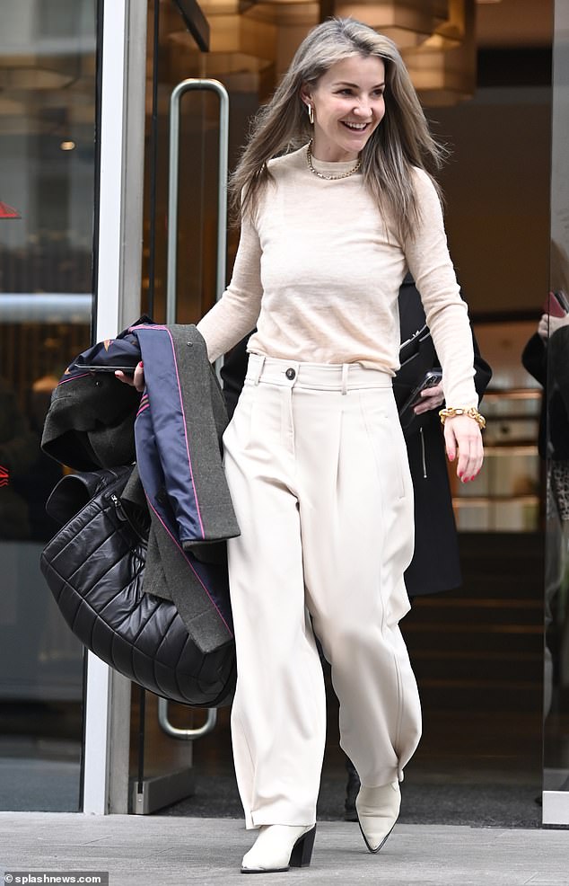 Chic: Helen looked chic in a cream-colored sweater that she paired with matching high-waisted pants