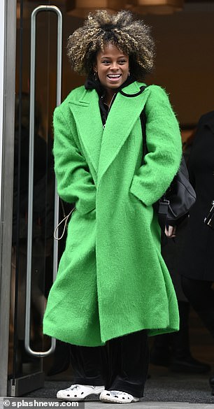 Green with envy: Fleur East turned heads in a bright green winter coat