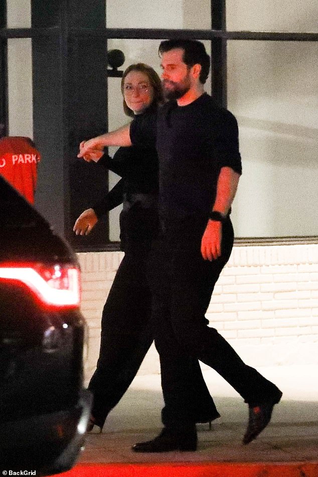 Cute couple: The Man Of Steel actor matched his other half in black as they strolled together hand in hand after lunch