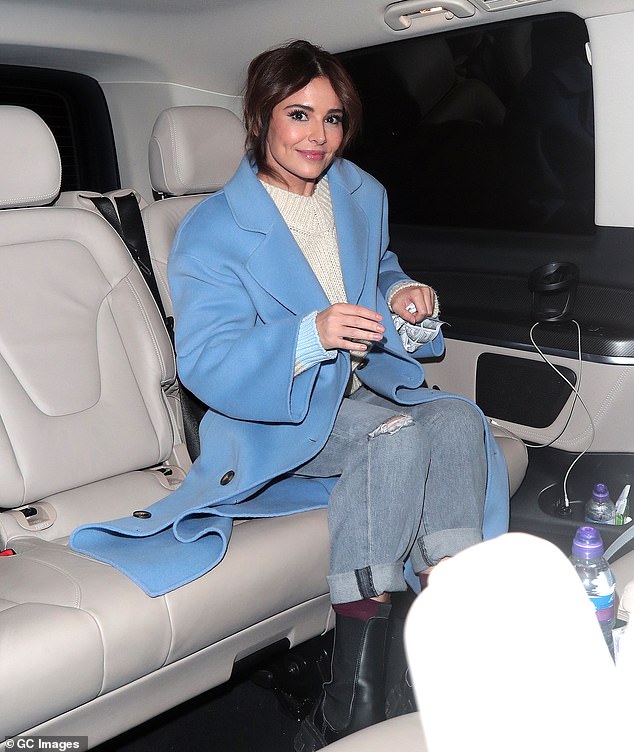 Beauty: She paired the look with ripped jeans and black boots as she smiled and chatted with them before getting into a waiting car