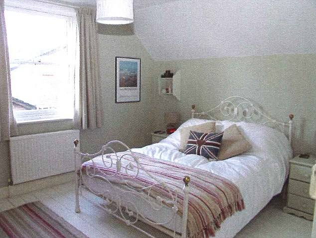 Fit for a princess: As she grew older, Kate traded her bedroom in the attic for a roomier one, seemingly bigger than her parents', that could fit a double bed and a desk.