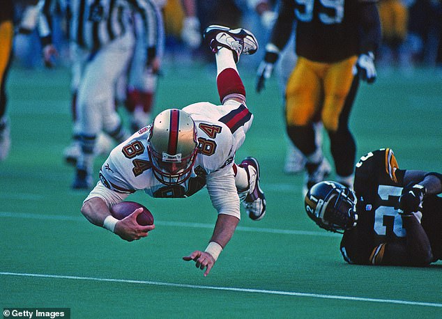 Jones dives into the end zone during a game against the Pittsburgh Steelers in December 1996.