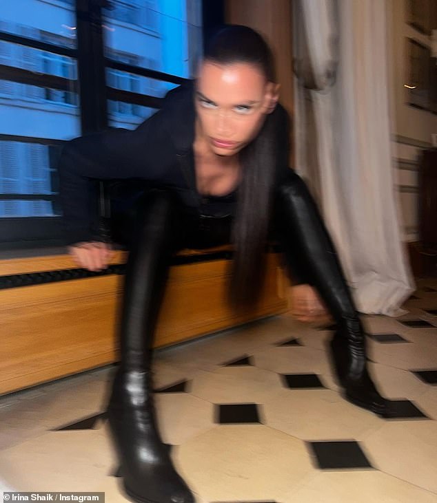 Sultry: She was wearing an all-black outfit in a blurry snapshot of herself posing in front of a window