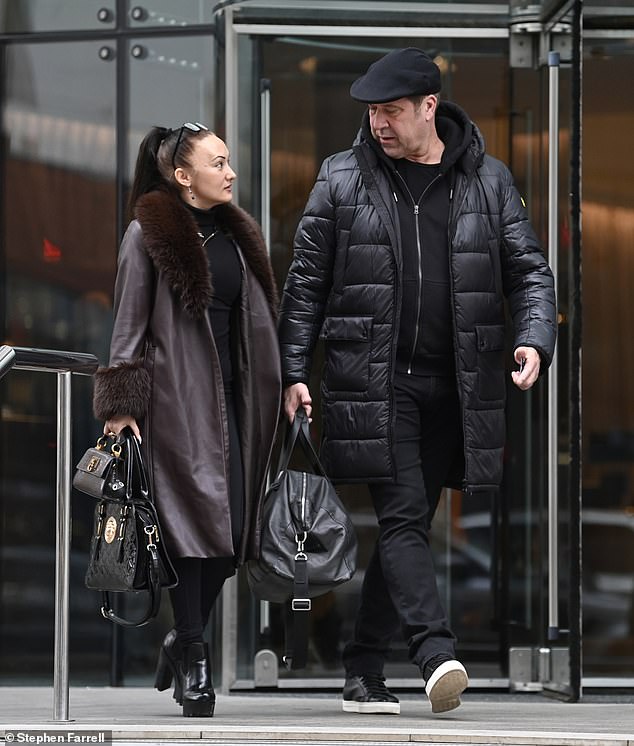 Coordinated: The couple almost completely color coordinated their outfits, with the professional ice skater breaking the mold in a dark maroon leather coat