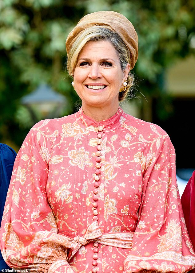 Queen Máxima (pictured) looked equally elegant in a colorful pink gown, cinched at the waist with a fashionable belt and featuring elegant button detailing down the front.