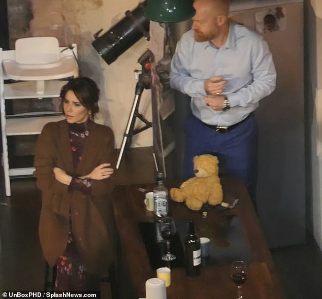 On stage: The former Girls Aloud star was seen dressed in a brown dress with a floral print and a brown wool cardigan on top while performing as her character Jenny (pictured with Jake Wood, who plays Ben )