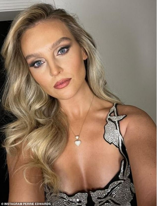 Gorgeous: The former Little Mix bandmate showed off her perfect hourglass shape in a black mini dress with a silver beaded detail around the chest, straps and neckline