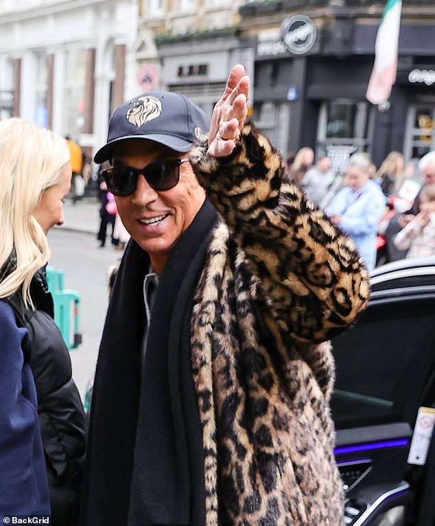 In style: New judge Bruno, 67, joined his fellow panelists as he waved to the cameras as he arrived at the London Palladium for another day of filming