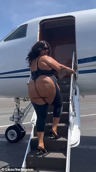 Lizzo looked confident as she got out of a car and boarded a private jet wearing a black version of the daring outfit in a viral video posted to her Instagram page.