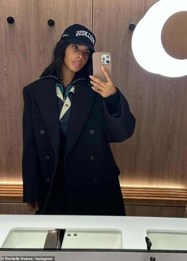 Selfie: Another snapshot in Rochelle's post showed her posing in a stylish cap, jacket and coat in a mirror