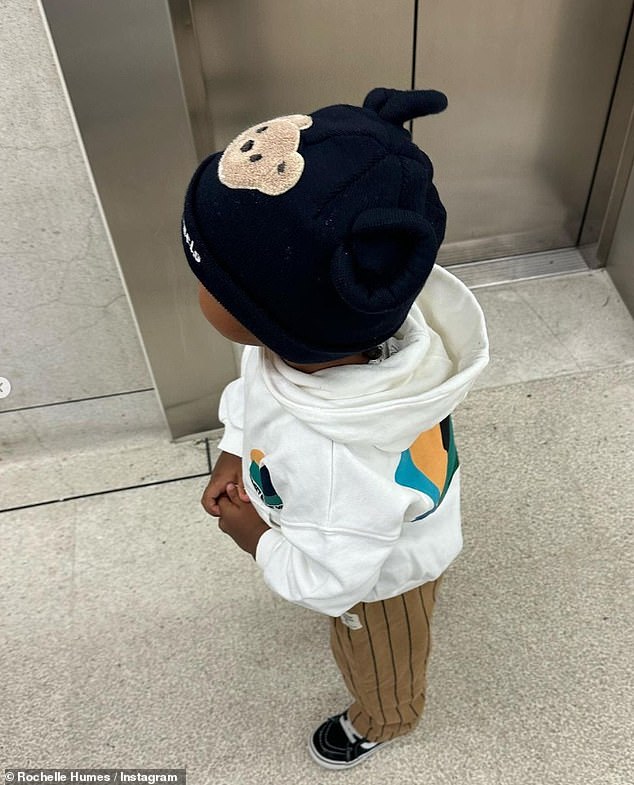 Cute: Wearing a hoodie, brown pants and a hat, there's a sweet snapshot of Rochelle's son Blake, which he also put in the photo collection