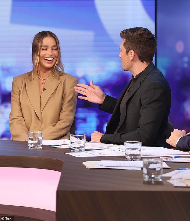 Sam, who has a degree in political science, explained that he felt pushed to the bottom.  In the photo, Margot Robbie being interviewed on The Project