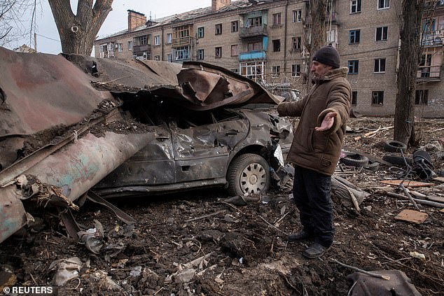 Carnage: A resident at the scene of a Russian attack in Kostiantynivka yesterday