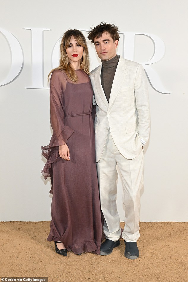 Stepping out: Waterhouse showed off her slender figure in a semi-sheer slip dress while posing with boyfriend Robert Pattinson at the Dior menswear show in Egypt;  Pictured December 3, 2022