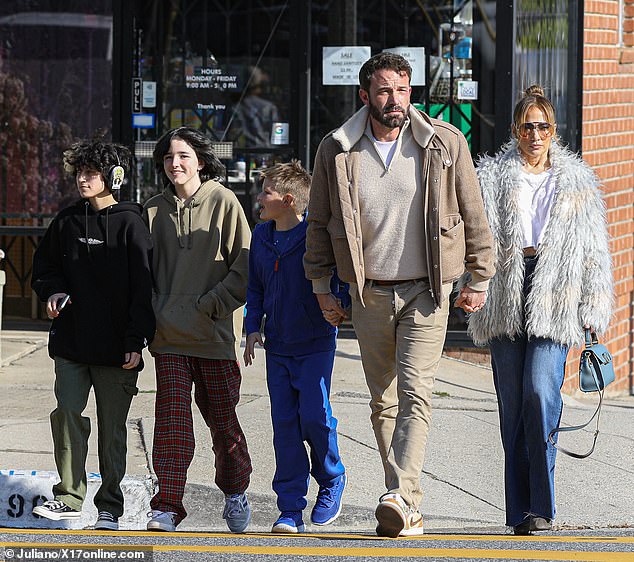 Mixed: Boston native Serafina Affleck's children, 14, and Samuel Affleck, ten, joined their father, 50, new stepmother, 53, and daughter Emme Muniz, also 14