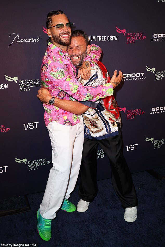 Good friends: The singer was photographed embracing David Grutman, who wore a multi-colored shirt and jet black pants