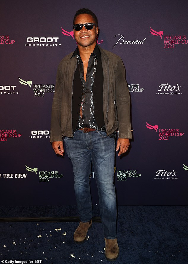 Appearing: Cuba Gooding Jr. kept his sunglasses on as he posed for a photo at the star-studded event