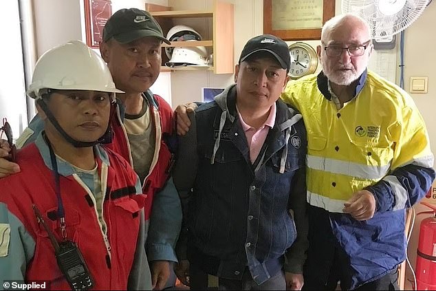 Stranded crew members (pictured left and center) receive help from the Transport Workers International Union, the Portland Seamen's Mission and The Salvation Army.