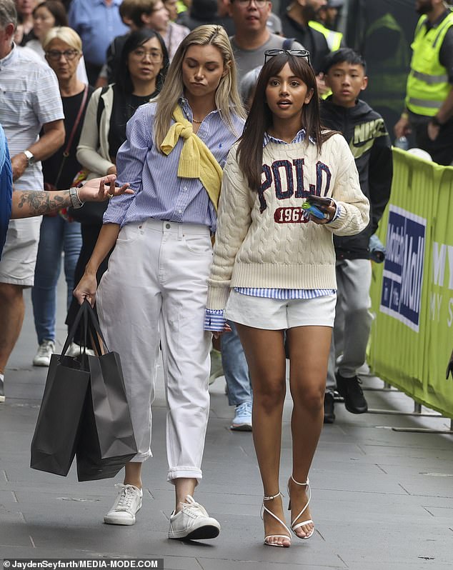 She added a pair of pristine white shorts, her daring length showing off her pins, as well as some strappy heels.