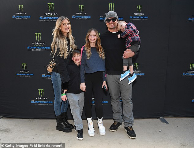 Coat: The 39-year-old reality star donned a black jacket, blue jeans and black boots for one of the biggest nights in motorcycle racing