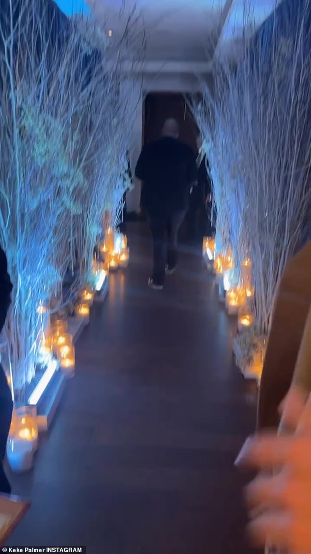 Creative: Guests walked through a decorated hallway to enter the baby shower party.