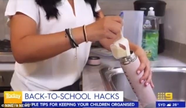 Anita put a third cup of uncooked rice in the bottle saying that the amount of rice can vary depending on the size of the container.