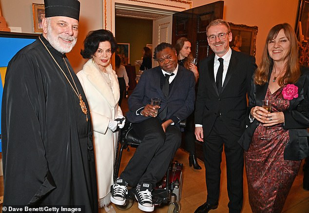 Journey: The actress, 77, ex-wife of Rolling Stones singer Mick, showed off her new 1950s hairstyle for the second time (pictured with other guests at the event)