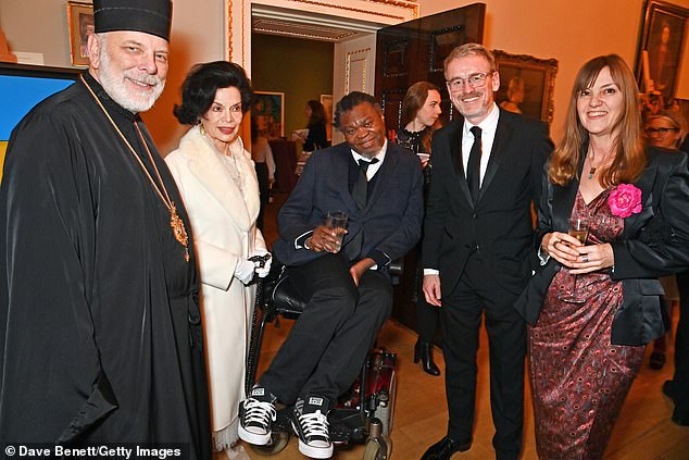 Mingling: The 'Art Without Borders' event was organized to raise funds for the National Academy of Arts of Ukraine (pictured with other attendees)