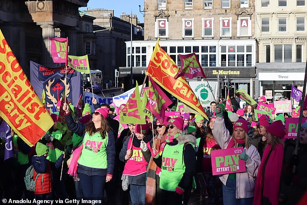 Teachers gather to demonstrate as they continue their strike demanding higher wages and better working conditions in Edinburgh, Scotland, on Thursday.