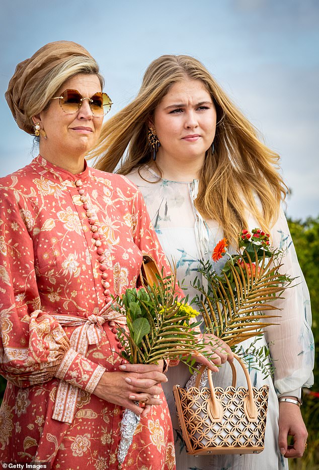 Earlier in the day, the family was photographed looking just as stylish as they hit some of Bonaire's sights (pictured left to right: Queen Máxima of the Netherlands and Princess Amalia)