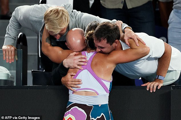 Sabalenka celebrates with her team after the victory comeback