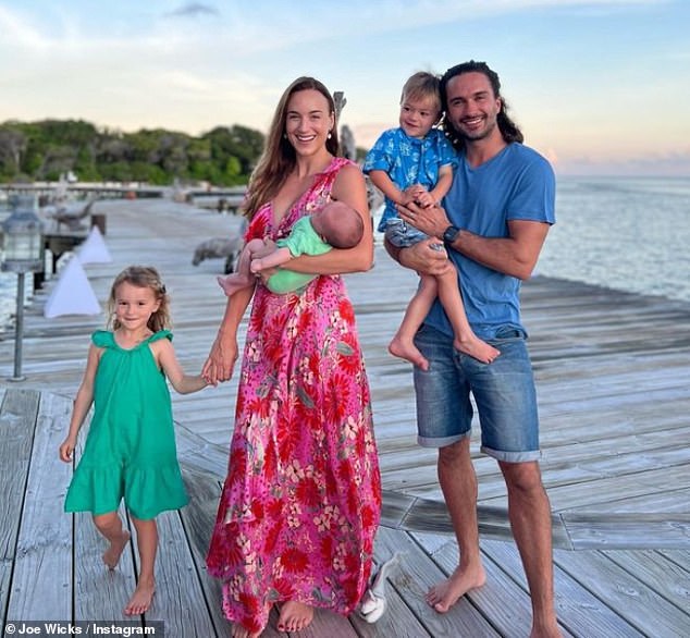 Family: Joe revealed that he and his wife Rosie would like to expand their brood.  Pictured: Indie, three, Rosie, Leni, Marley and Joe on vacation in the Maldives in October