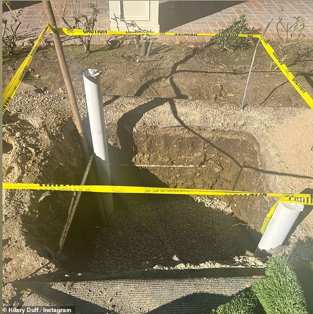 Witty: Hillary kept up the cheeky humor when she posted a photo of a gigantic hole that was meant for one of her trees, writing: 'I know... I thought it was for @mathewkoma too but it's for an aloe baines [tree]!!!'