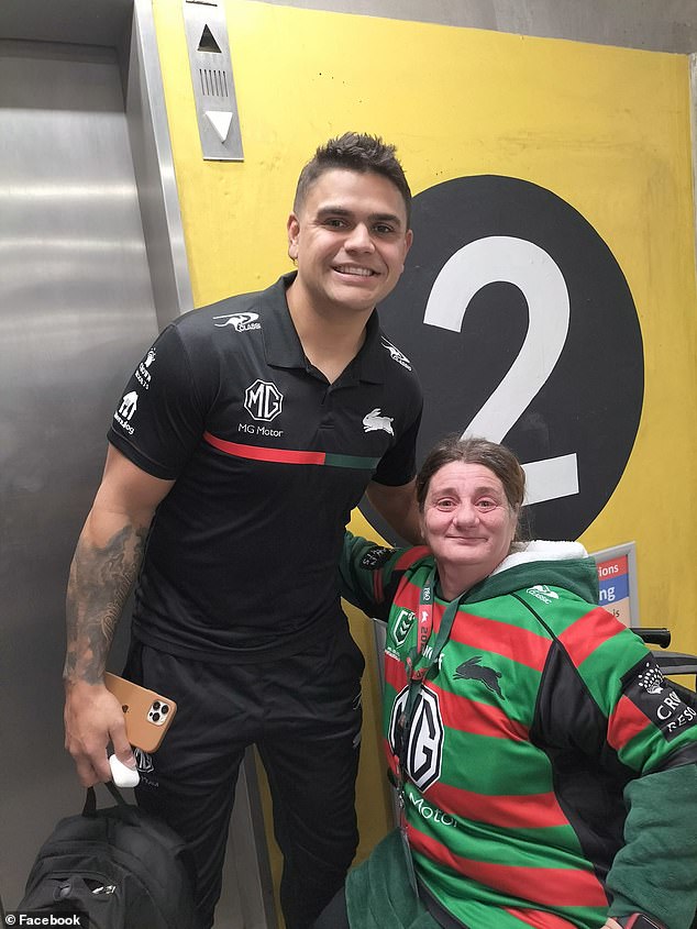 Rabbitoh's fan had passed out from the heat and was tended to by Burgess (pictured with Latrell Mitchell)