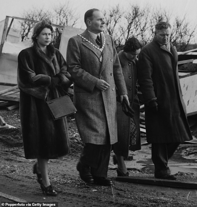 The late Queen Elizabeth II (pictured left) visited the aftermath and witnessed the devastation caused by flooding in the Norfolk area on February 2, 1953.