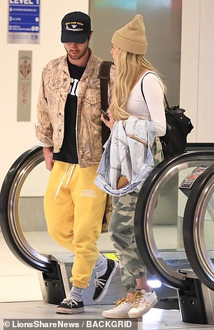 Casual: The Tennessee native rocked a pair of white Golden Goose sneakers with green and gold accents.