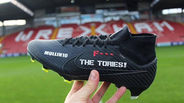 Paul Mullin shared photos of custom boots with the same message, which he did not wear