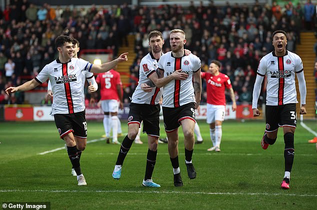 Sheffield United striker Oli McBurnie (second right) headed in a corner after two minutes