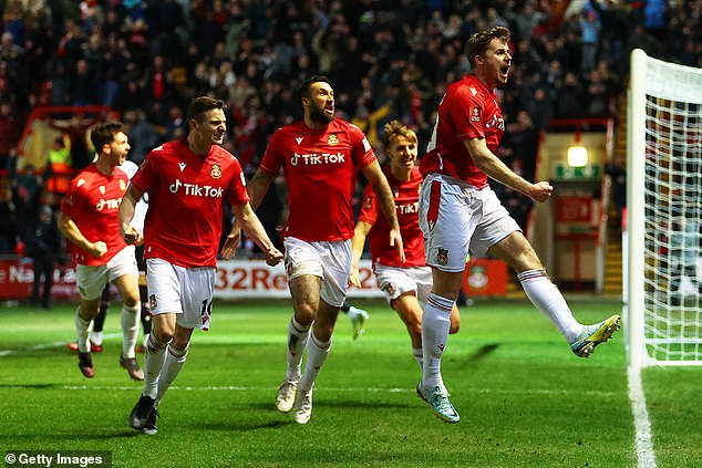 But Wrexham midfielder James Jones (right) equalized in the second half after a long drive.