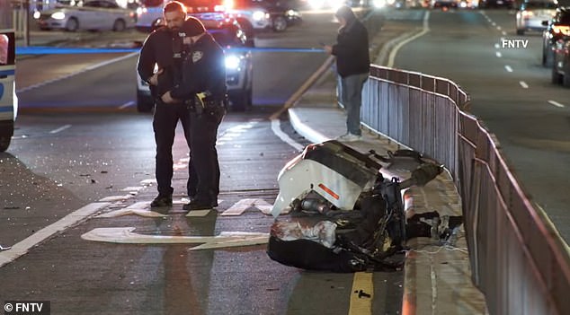 The vehicle struck a barrier wall before spinning and crashing into a wooden utility pole, police said.