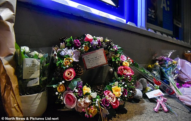 A message left by a loved one reads: 'All our love to the most beautiful girl in the world.  We will miss you forever Holly'.  Pictured: Tributes left at the site